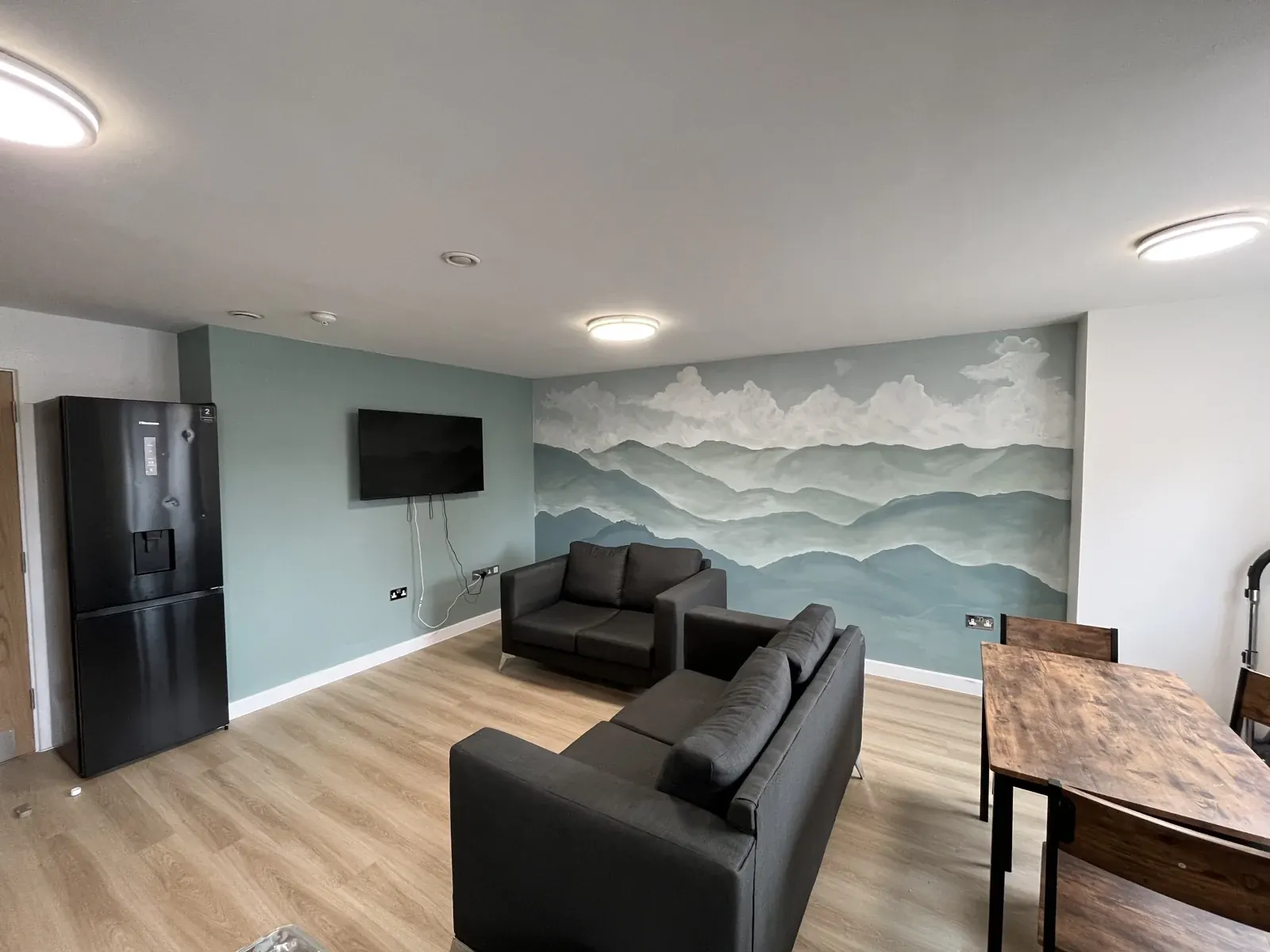 Mountain mural and furnished room