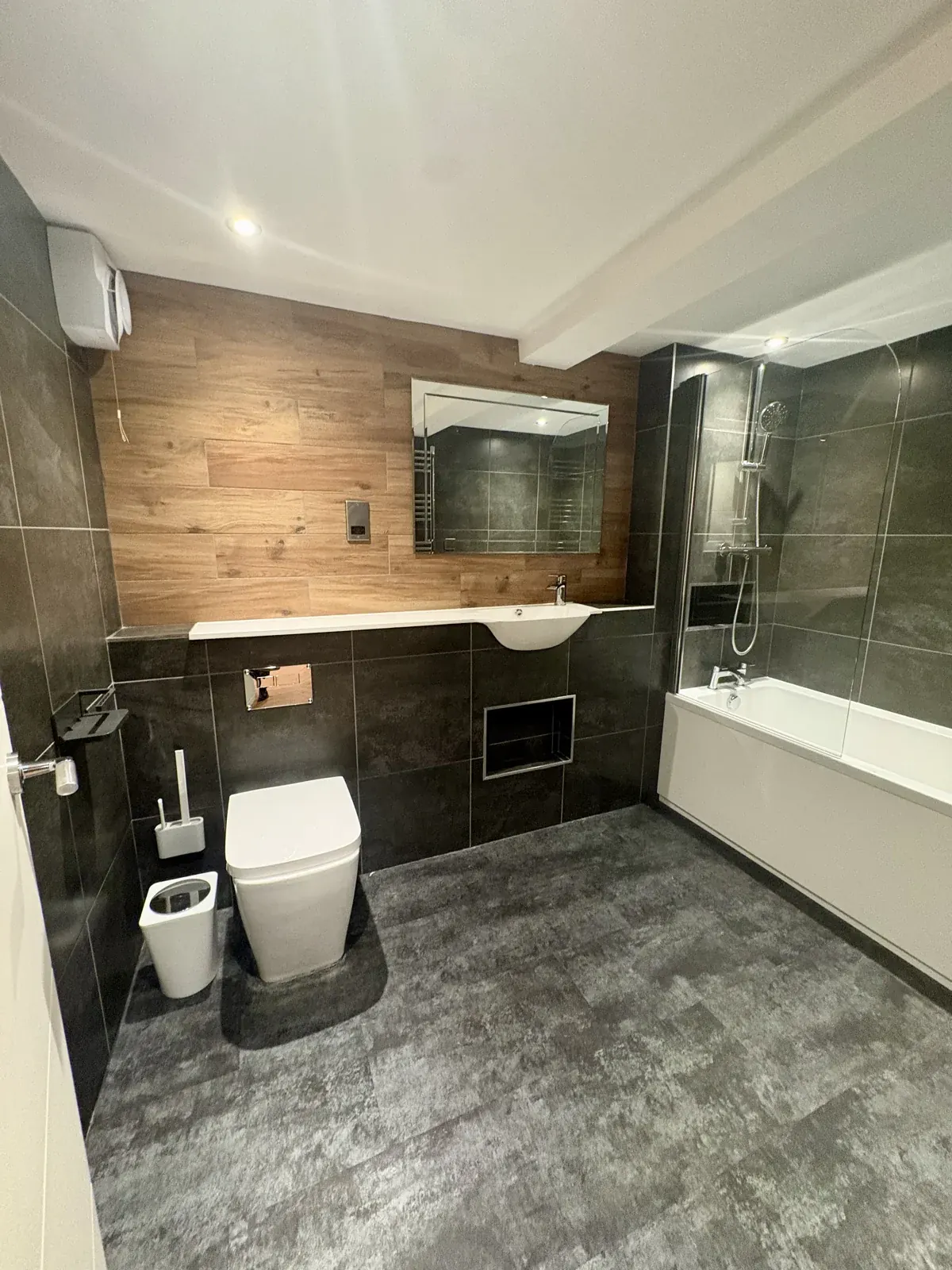 Bathroom with bath and overhead shower