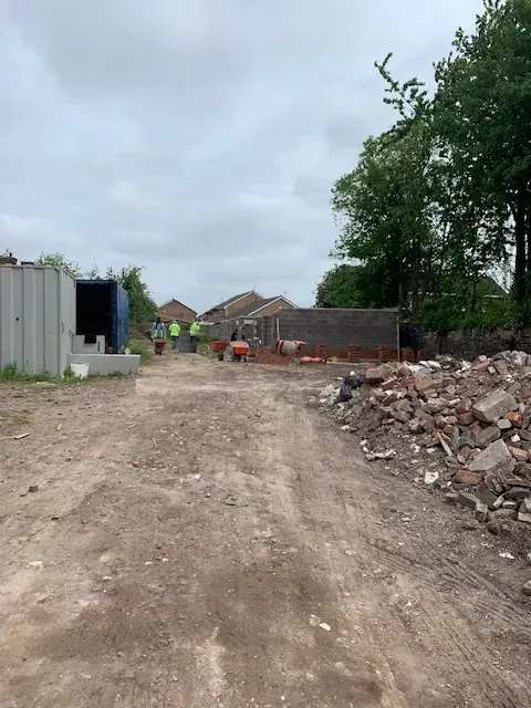 After demolition, with early building work under way